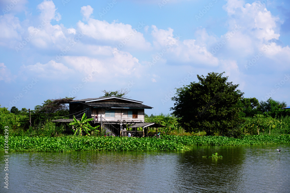 House on stilts. Views of the city's Slums from the river House on stilts. Views of the city's Slums from the river