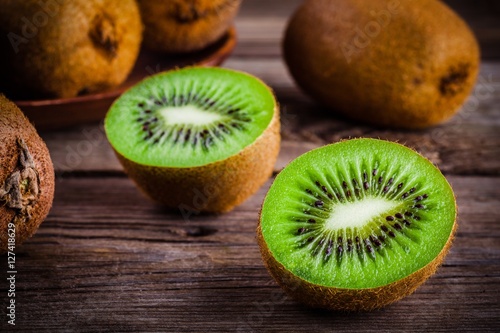organic fresh juicy kiwi on dark wooden background