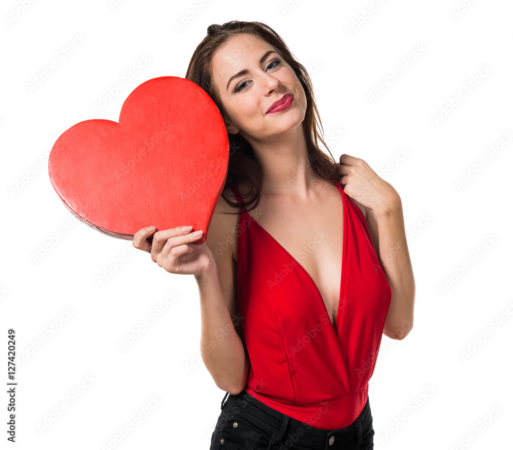 Pretty young girl holding a heart Pretty young girl holding a heart