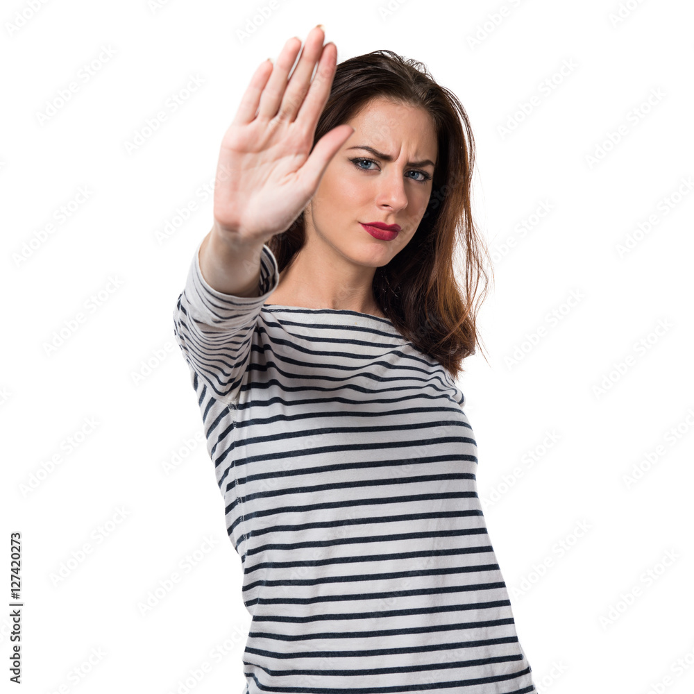 Pretty young girl making stop sign Pretty young girl making stop sign