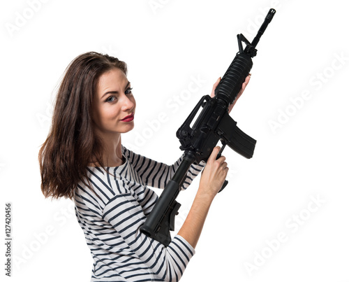 Pretty young girl holding a pistol