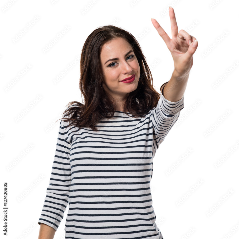Pretty young girl making victory gesture Pretty young girl making victory gesture