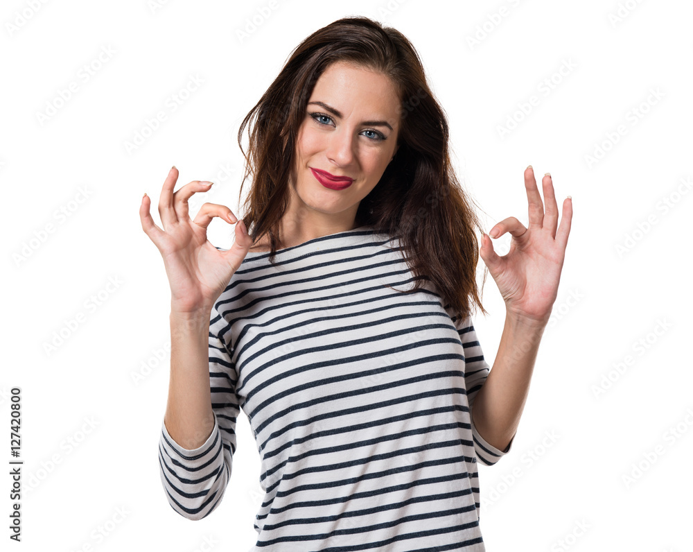 Pretty young girl making OK sign Pretty young girl making OK sign