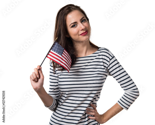 Pretty young girl holding an american flag