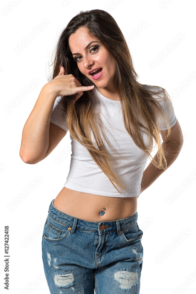 Young pretty girl making phone gesture Young pretty girl making phone gesture