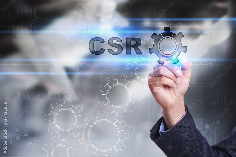 Businessman is drawing on virtual screen. csr concept Businessman is drawing on virtual screen. csr concept