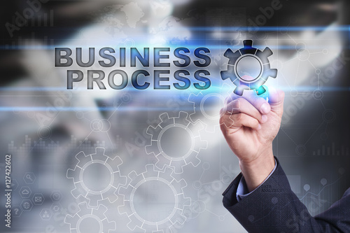 Businessman is drawing on virtual screen. business process concept