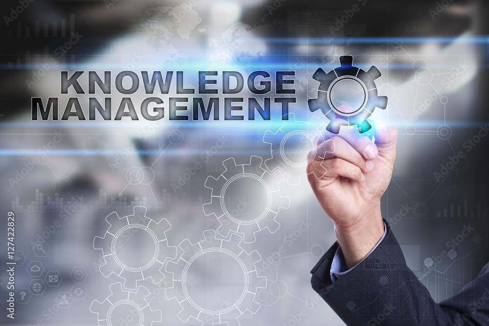 Businessman is drawing on virtual screen. knowledge management concept Businessman is drawing on virtual screen. knowledge management concept