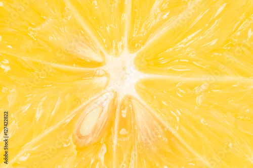 Extreme close up of a half sliced lemon