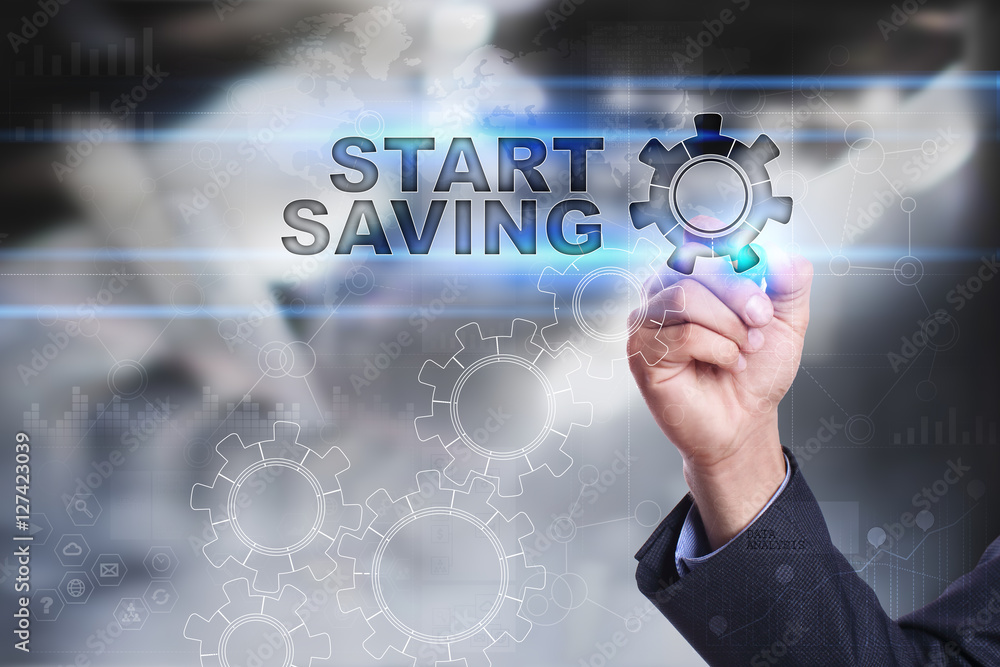 Businessman is drawing on virtual screen. start saving concept Businessman is drawing on virtual screen. start saving concept