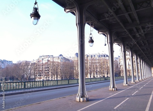 beautiful street in Paris under metal structure built in 18th century for public transport