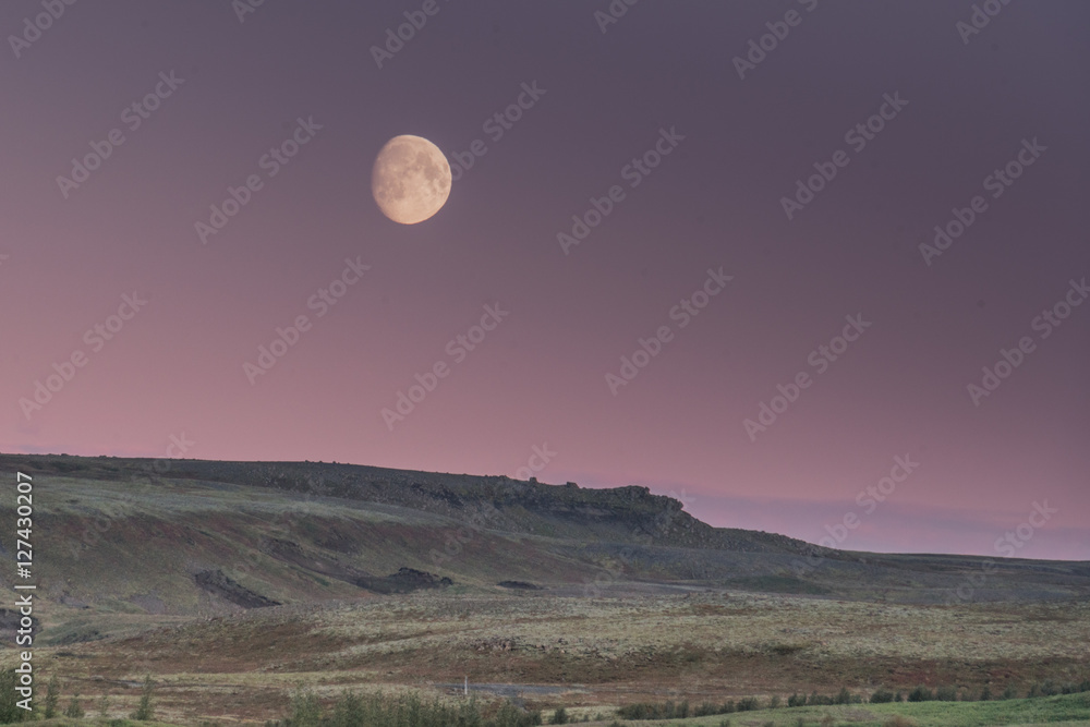 Moonrise while the sunsets over the hills viewed from Gullfoss Iceland Moonrise while the sunsets over the hills viewed from Gullfoss Iceland