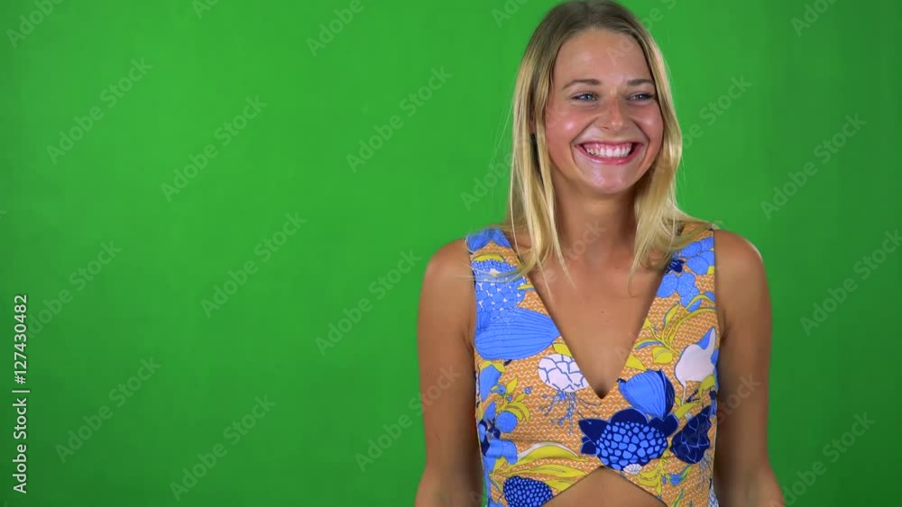 young pretty blond woman rejoices - green screen - studio young pretty blond woman rejoices - green screen - studio