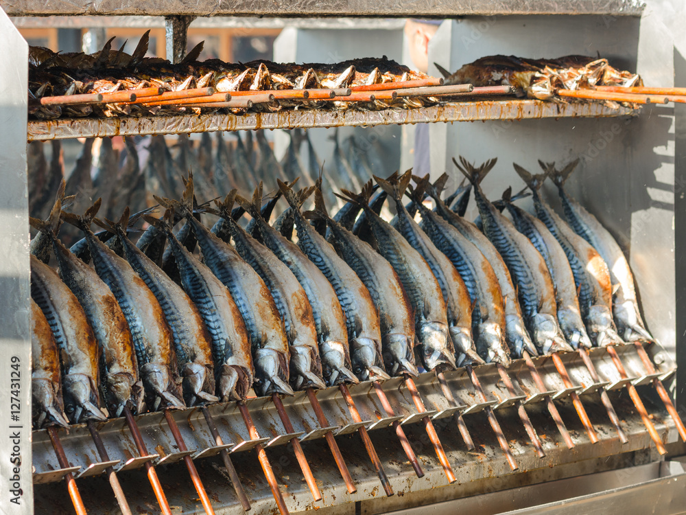 Cooking grilled mackerel on skewers