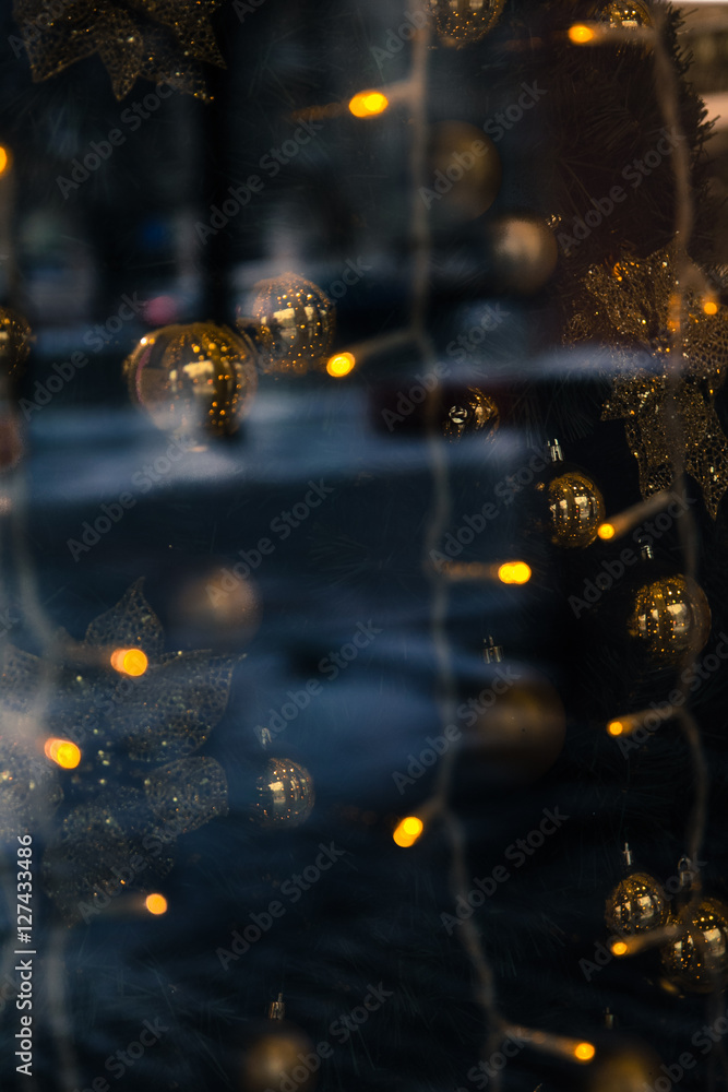 the reflection in the window Christmas lights, toys and people as a background, base, bright and festive. Vague and abstract the reflection in the window Christmas lights, toys and people as a background, base, bright and festive. Vague and abstract