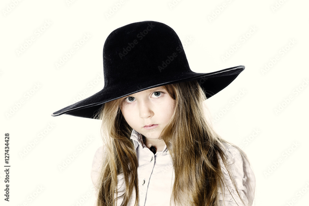 LIttle girl posing like a model in mother's hat LIttle girl posing like a model in mother's hat
