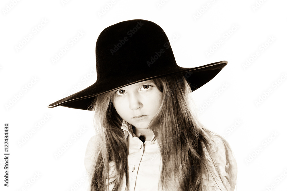 LIttle girl posing like a model in mother's hat LIttle girl posing like a model in mother's hat