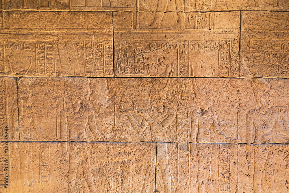Fototapeta premium Real Hieroglyphic carvings on the walls of an ancient egyptian templ