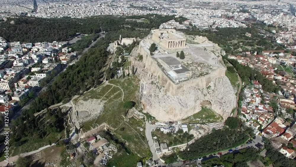 Aerial drone top down view looking down onto front of Acropolis of Athens ancient citadel located on rocky outcrop showing Parthenon very famous tourist attraction in Europe Greece downtown Athens 4k Aerial drone top down view looking down onto front of Acropolis of Athens ancient citadel located on rocky outcrop showing Parthenon very famous tourist attraction in Europe Greece downtown Athens 4k