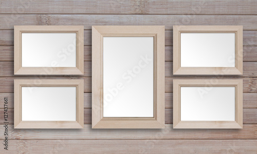 Collage of five blank wooden photo frames on wooden panels background, interior mock up. Countryside style decor