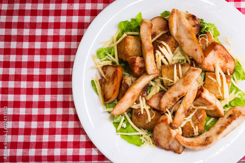 Caesar salad with chicken and croutons