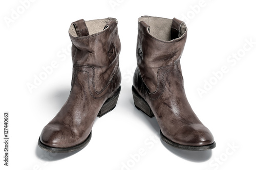 Pair of traditional cowboy boots retro tone