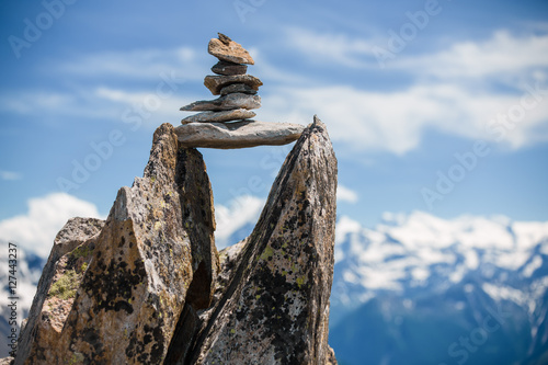 Fotografie Stones cairn bridging gap near Eggishorn, Alps