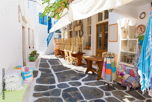 whitewashed narrow street in Mykonos island, Cyclades, Greece