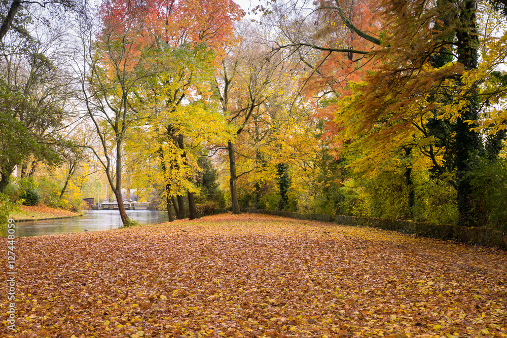 Golden autumn in Minnewater park in Bruges, Belgium Golden autumn in Minnewater park in Bruges, Belgium