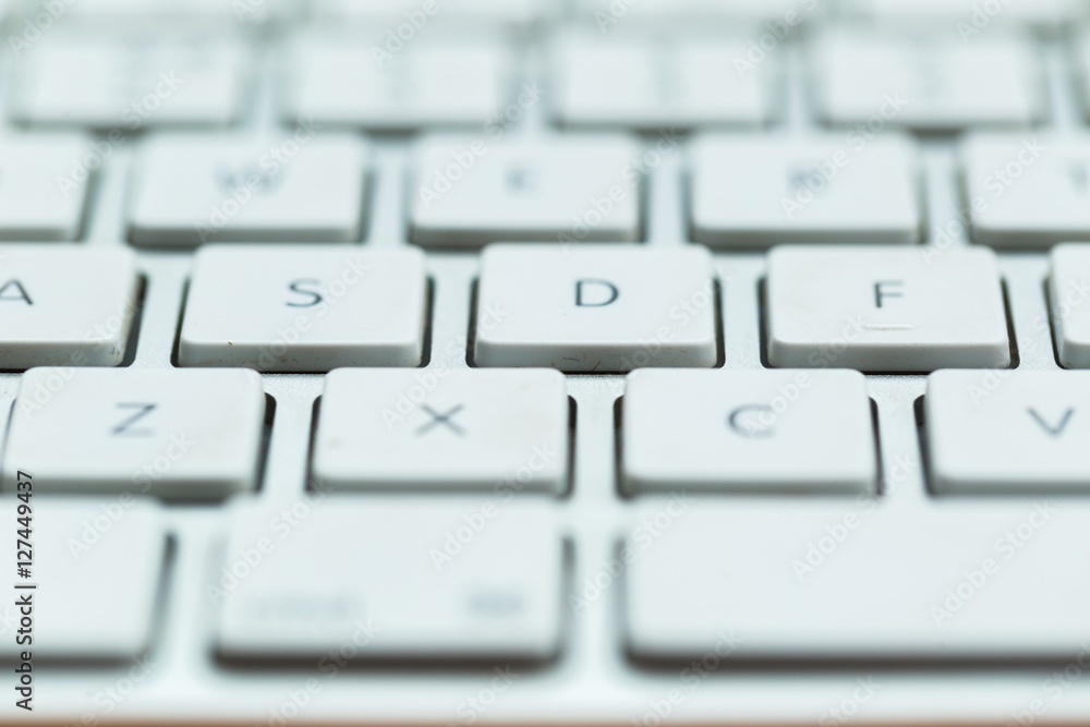 Close up of white wireless aluminum keyboard Close up of white wireless aluminum keyboard