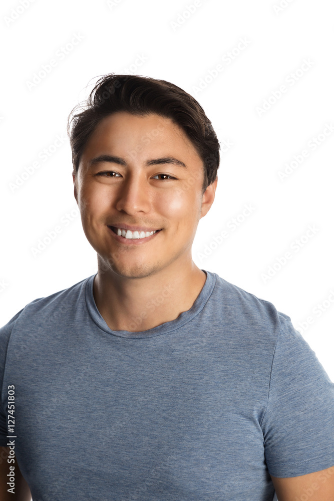 Handsome relaxed man wearing a tshirt and pants standing against a white background, relaxed looking. Handsome relaxed man wearing a tshirt and pants standing against a white background, relaxed looking.