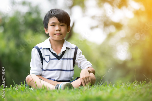 Portrait of a little asian boy in the park