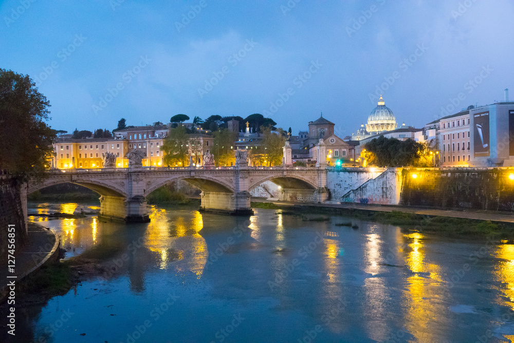 Wonderful River Tiber and the ancient bridges in Rome - romantic view in the evening