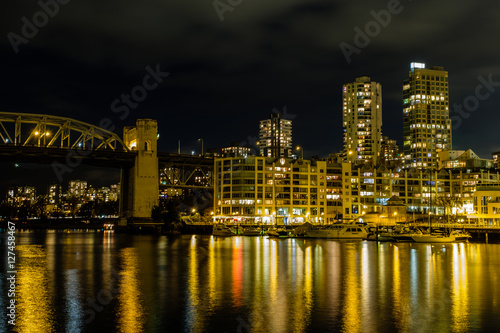 Vancouver cityscape at night skyscrapers and bridge