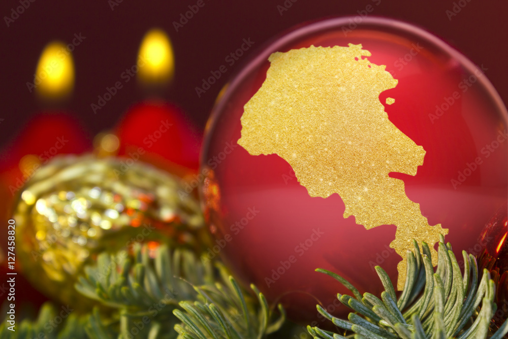 Red bauble with the golden shape of Armenia.(series)