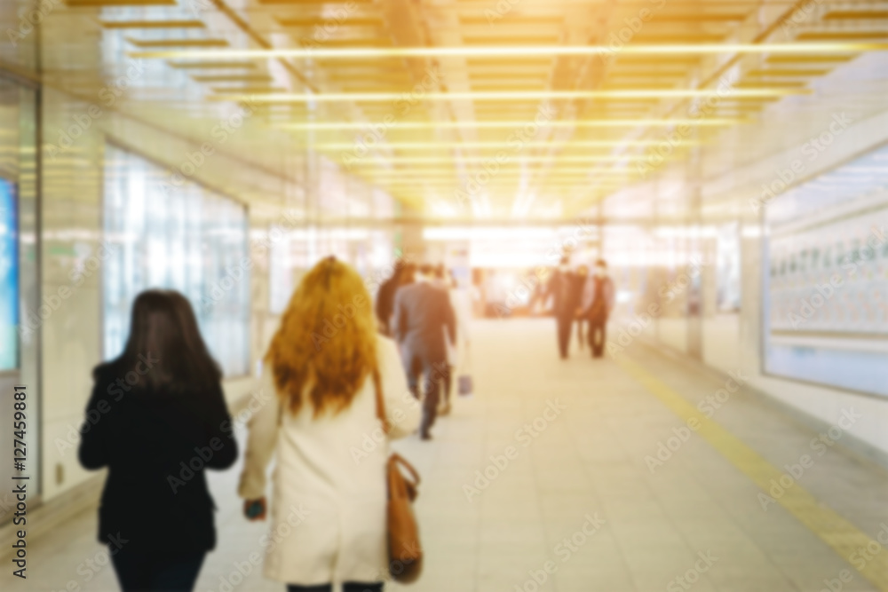 business people walking in the corridor, blurry