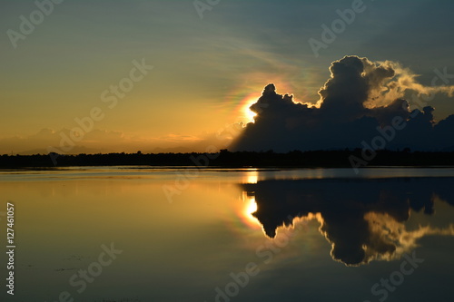 the cloudy reflection with river when sunset.