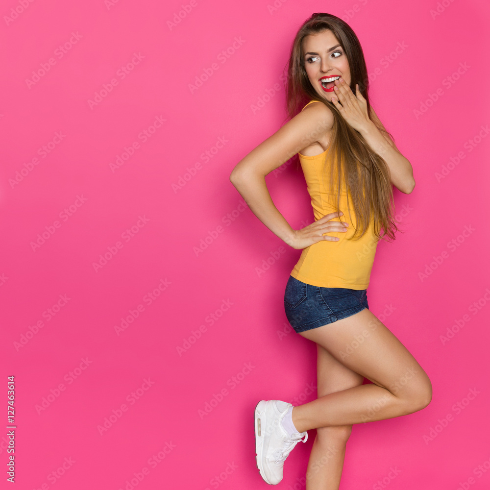Excited Girl Looking Over Shoulder. Side View Excited Girl Looking Over Shoulder. Side View