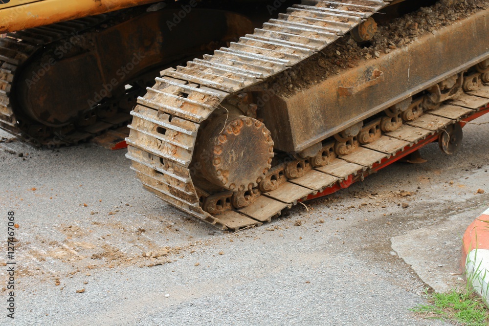 Wheel of excavator bulldozer loader machine  moving to construction