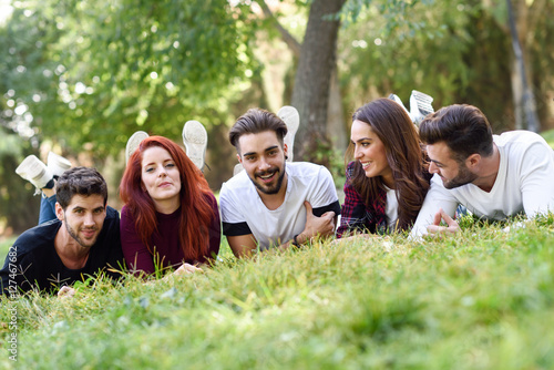 Group of young people together outdoors in urban background