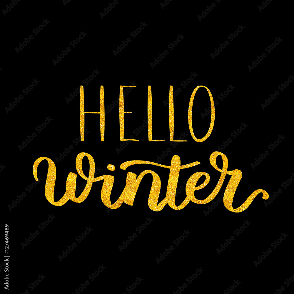 Fototapeta hand written phrase about winter. Golden Lettering on black isolated background. gold ink quote for your overlay and card design.