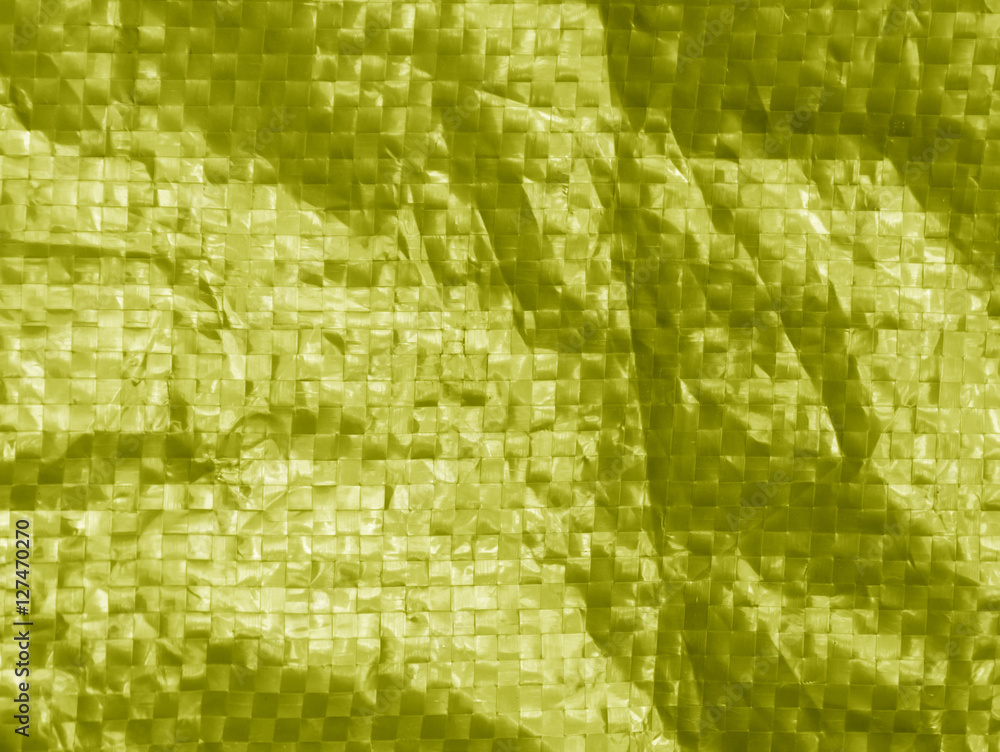 yellow color plastic bag surface with blur effect. yellow color plastic bag surface with blur effect.