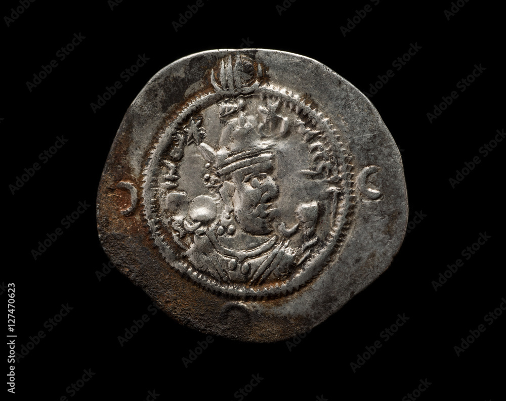 Ancient silver Sassanian coin isolated on black Ancient silver Sassanian coin isolated on black