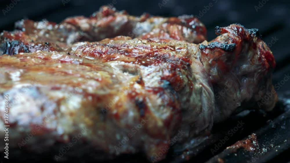 meat (beef) fries on the grill - detail of beef meat (beef) fries on the grill - detail of beef