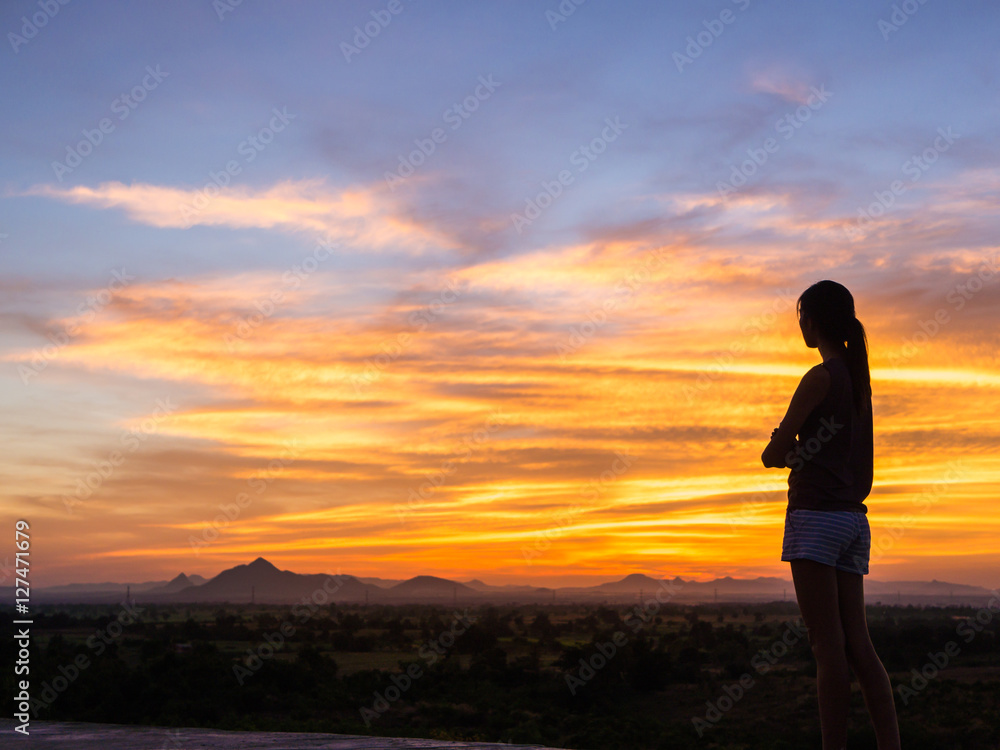 Free happy woman enjoying nature sunset. Freedom, happiness and enjoyment concept of young multiracial Asian