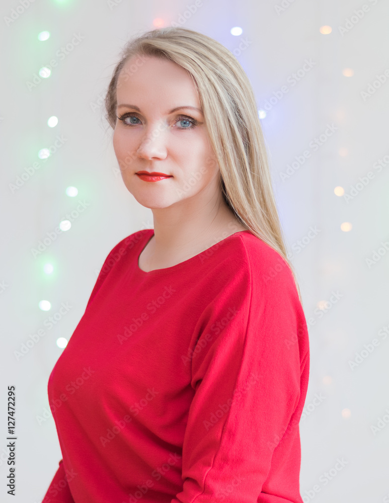 Fototapeta premium Beautiful woman on the background of colored lights.
