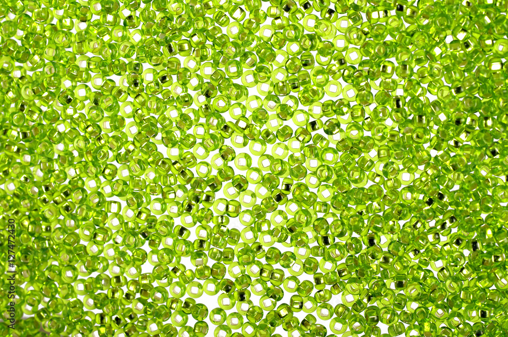 Green glass beads background - closeup beads texture Green glass beads background - closeup beads texture