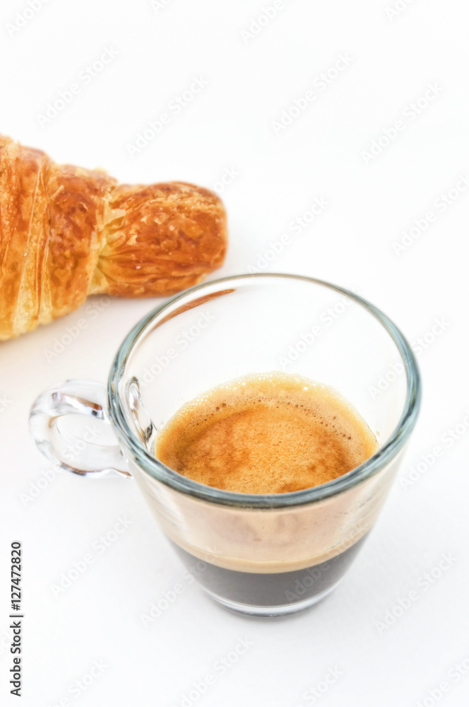 Espresso coffee and croissant on white background Espresso coffee and croissant on white background