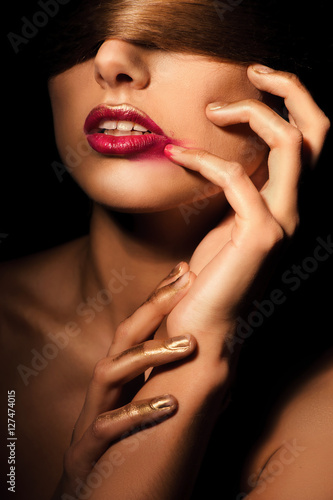 A girl with a bandage on his eyes as her hair and smeared lipstick on her lips