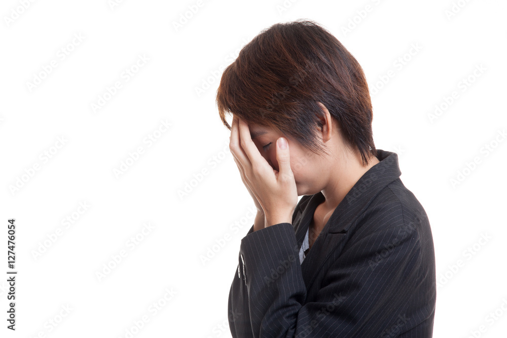 Sad young Asian businesswoman cry with palm to face. Sad young Asian businesswoman cry with palm to face.